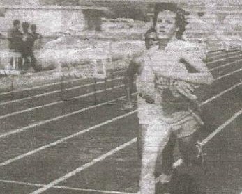 Author (in his younger days) running track in high school