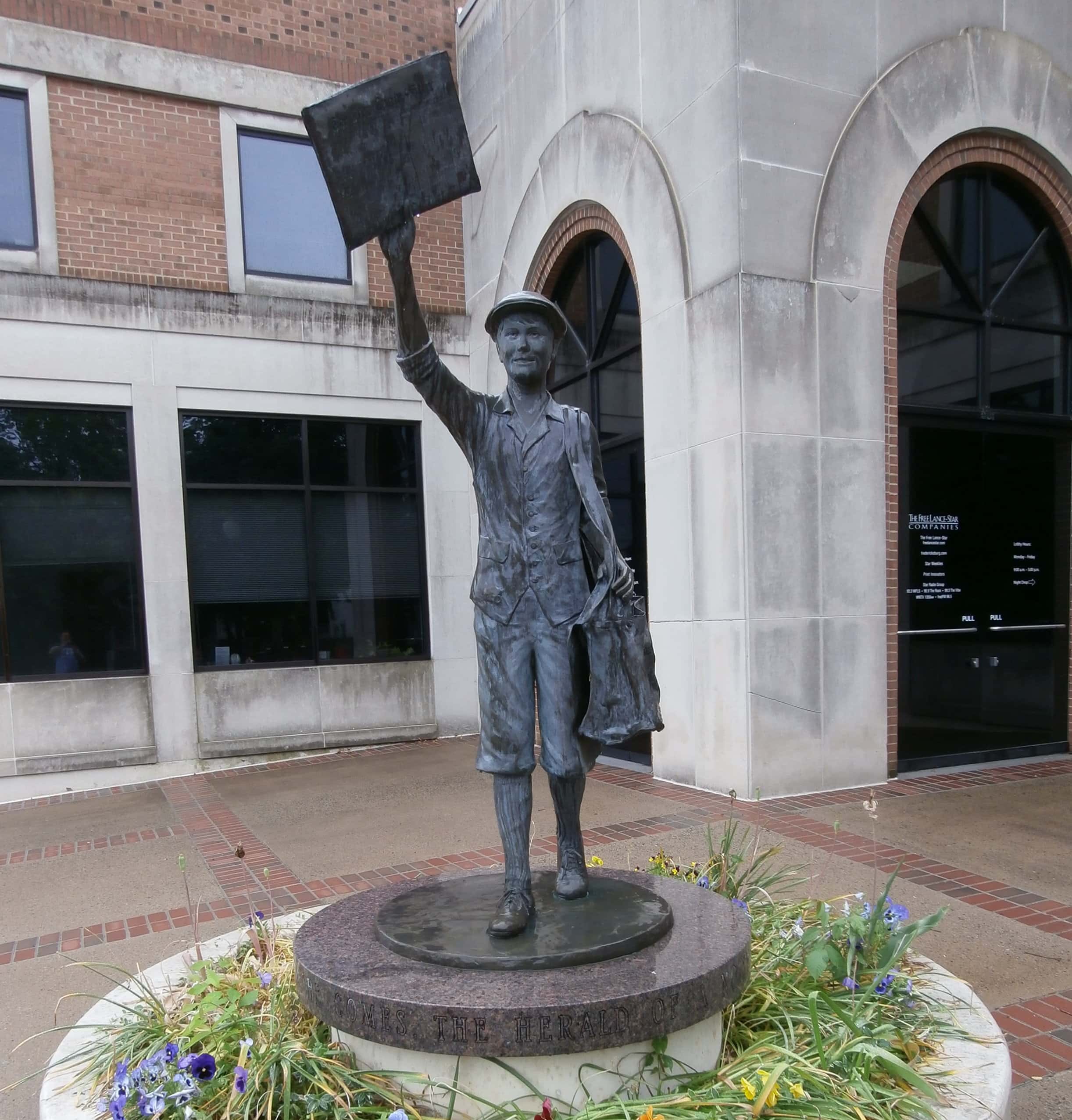 Newspaper Carrier statue at the Free-Lance Star Building - Fredericksburg, Virginia