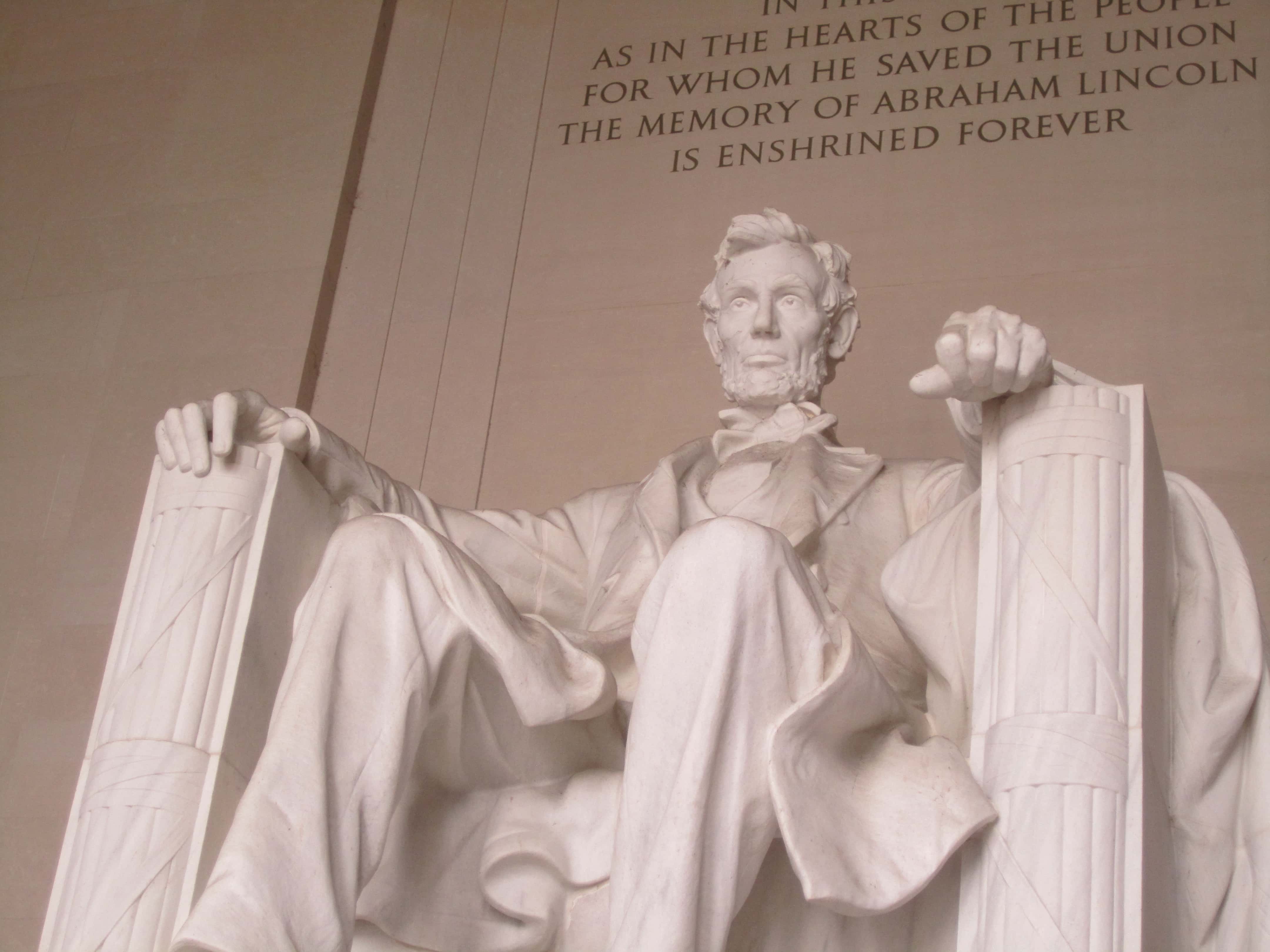 Lincoln sitting at the Lincoln Memorial