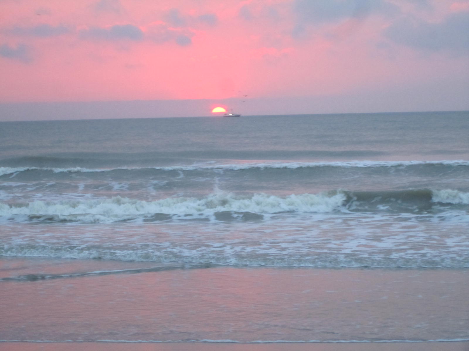 Sunrise over Cocoa Beach - Ship Slipping by the Sun